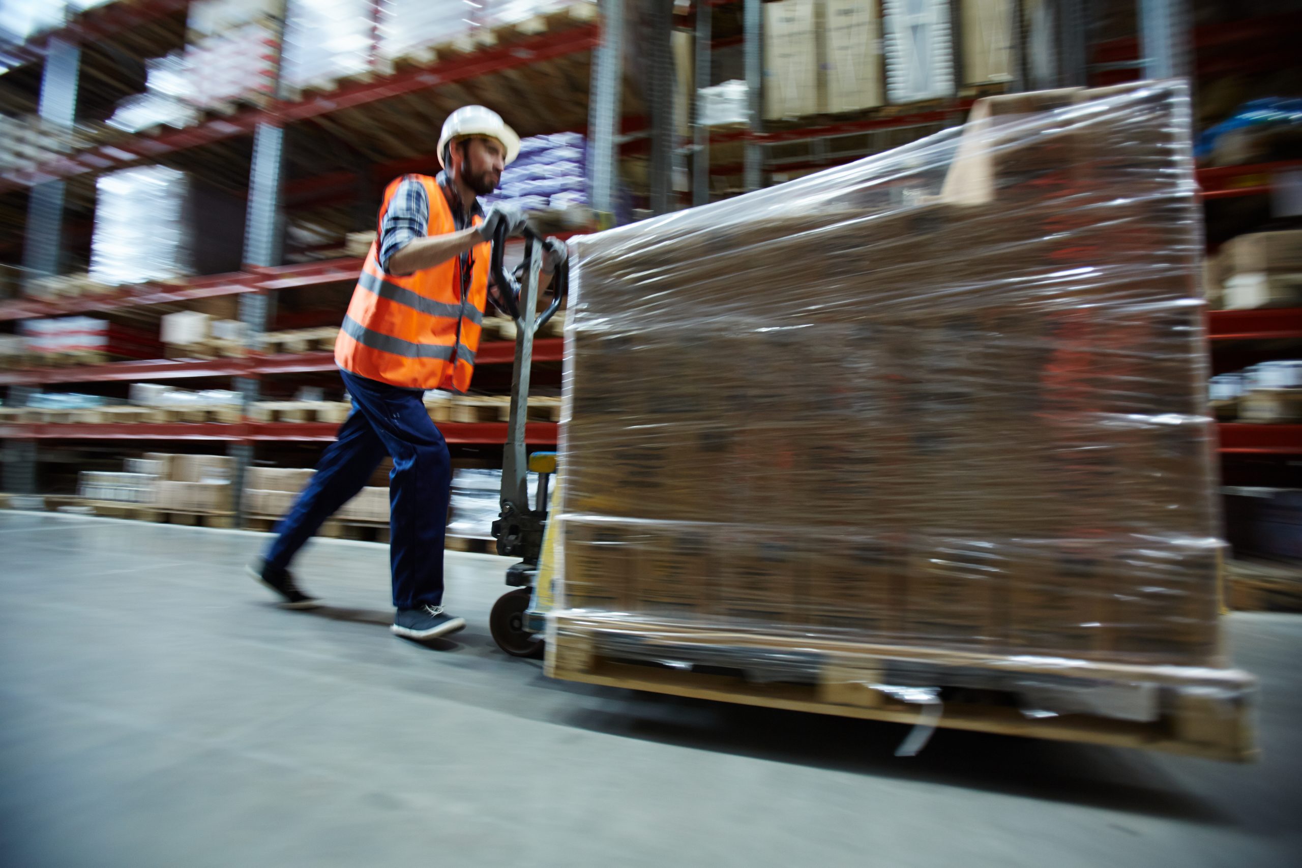 warehouse worker pushing load